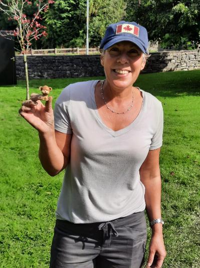 A person holding a toy found during the excavation