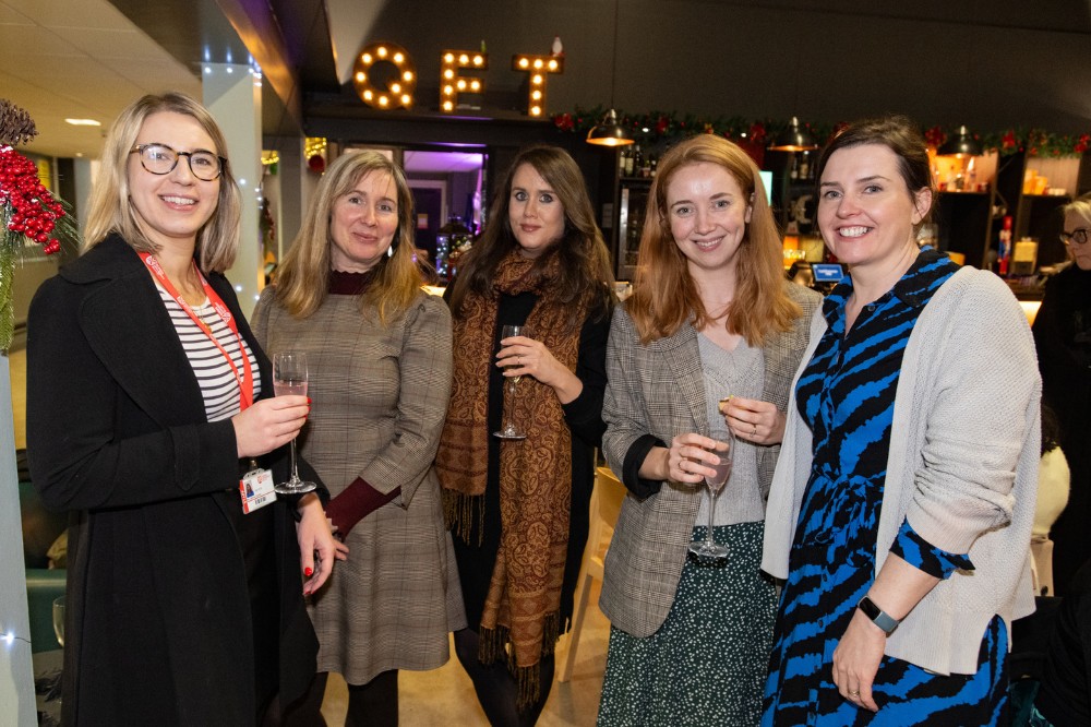 staff at a reception in the QFT foyer ahead of the screening of 'Delivering the Impossible: Agreement Twenty Five' documentary, 5 December 2023.