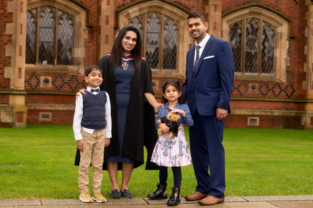 new female International graduate and family celebrating at Winter graduation 2023