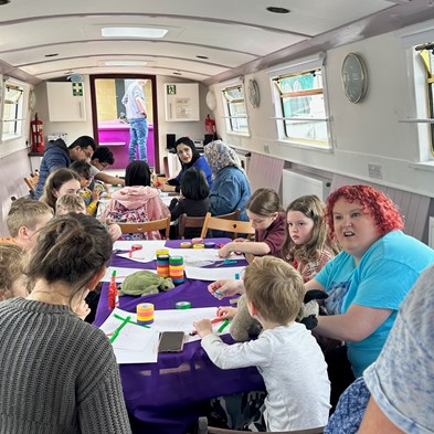 Participants taking part in activities on the canal boat with Fountainbridge Canalside Community Trust