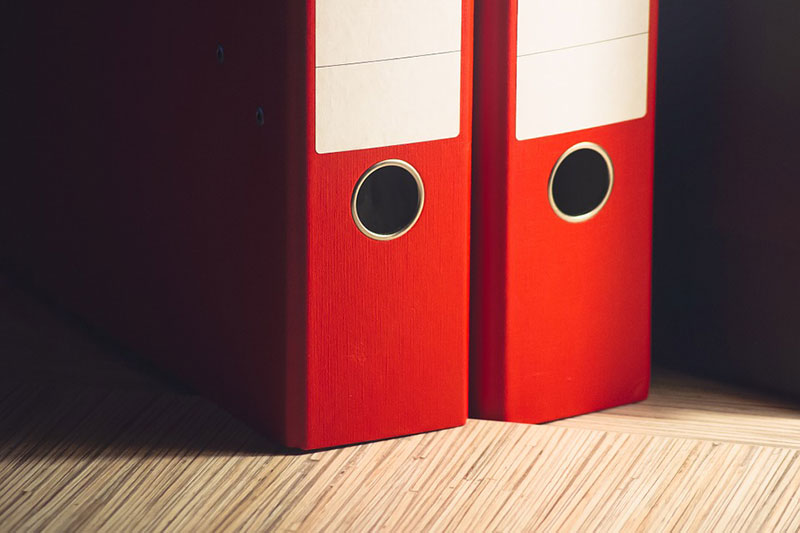 Close up picture of two red folders