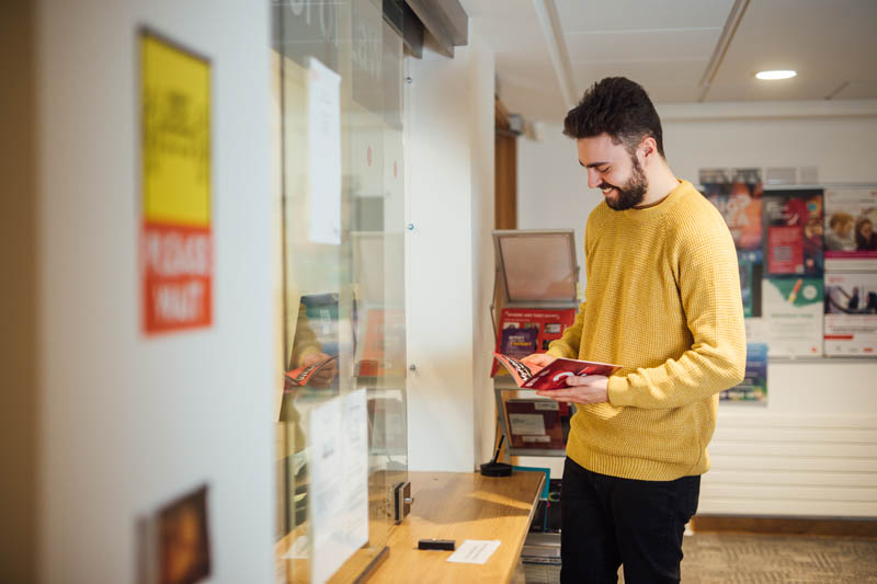 Image of student at School office window 