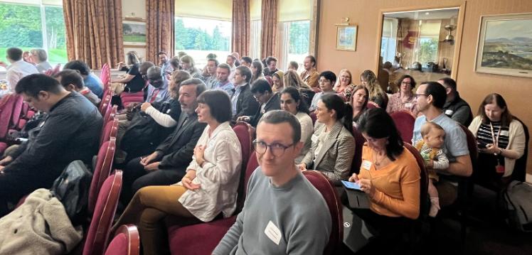 postdoctoral staff seated in an auditorium during the Postdoc Showcase 2022