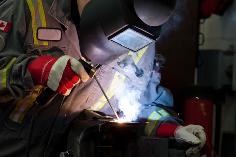 welder with a mask on