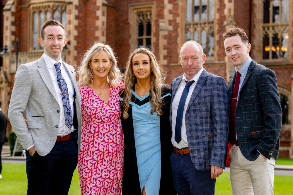 female Actuarial Science graduate with her family of actuaries