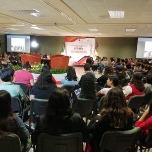 Many students at a large room watching an online presentation