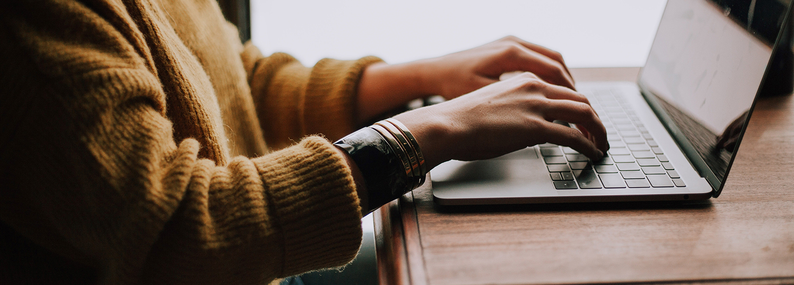 Person typing on a laptop