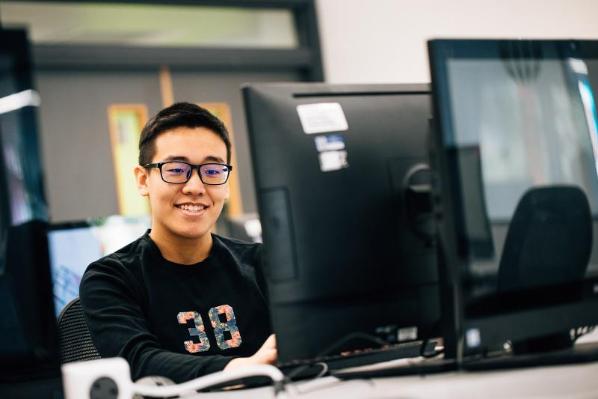 Male student working at a computer