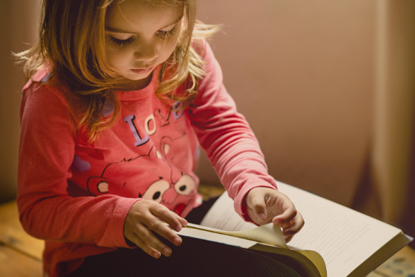 Child reading a book