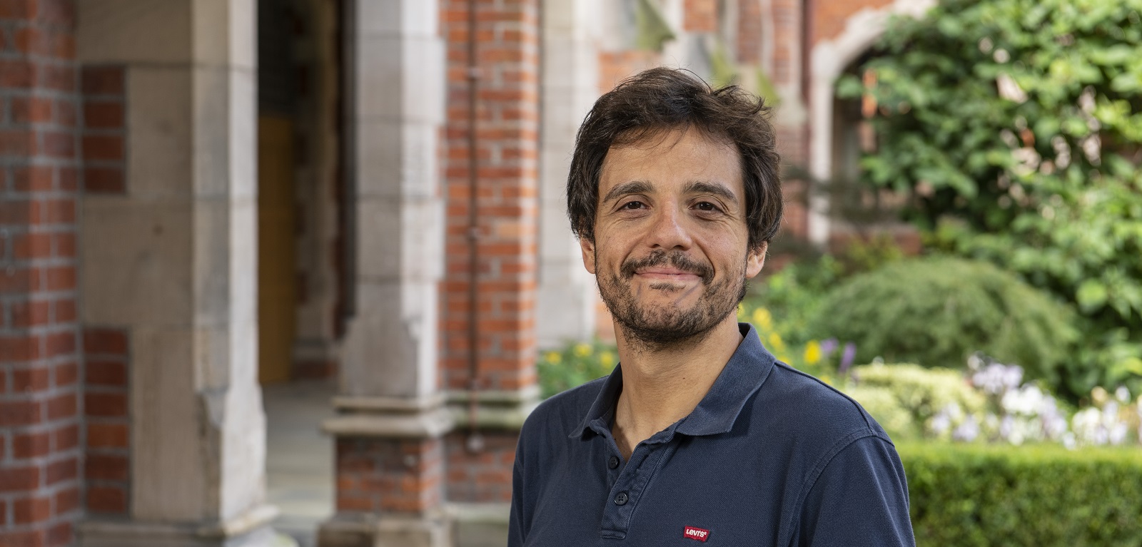 head and shoulders crop of Professor Mauro Paternostro in the cloisters in Queen's University Belfast, 2019