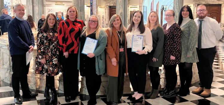 The first cohort of successful Queen's Administration Academy applicants at a celebration event in Belfast City Hall, October 2024