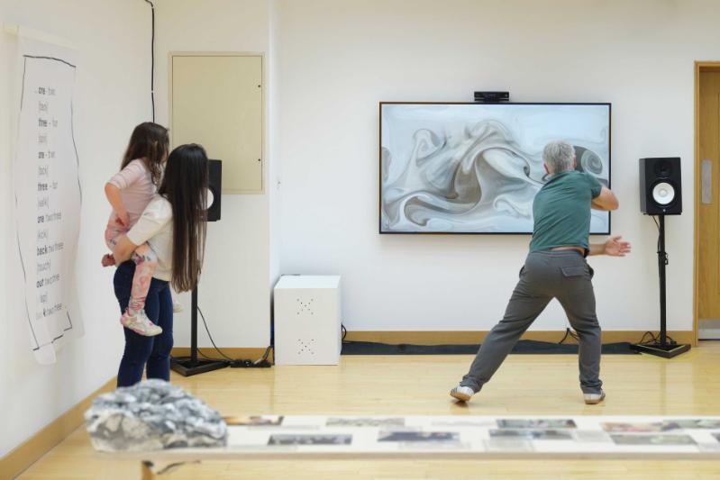 Person interacting with the interactive digital artwork