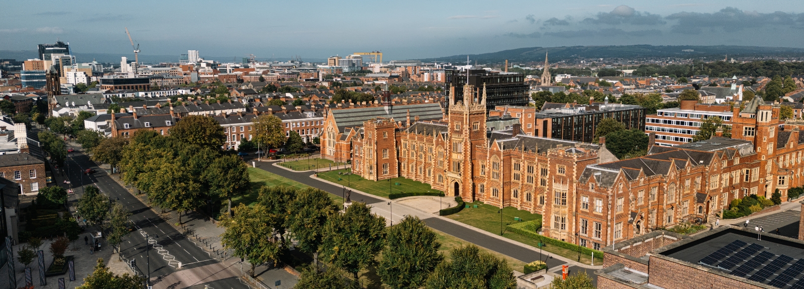 Queen's University Belfast, aerial view from the south west taking in the surrounding Queen's Quarter area and looking towards Belfast Harbour/Lough