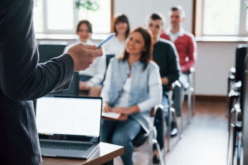 trainer teaching a classroom of young adults